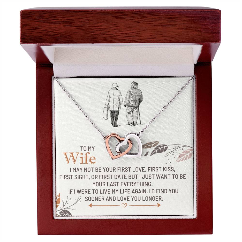 Silver-toned heart pendant necklace in a red box with a printed message card