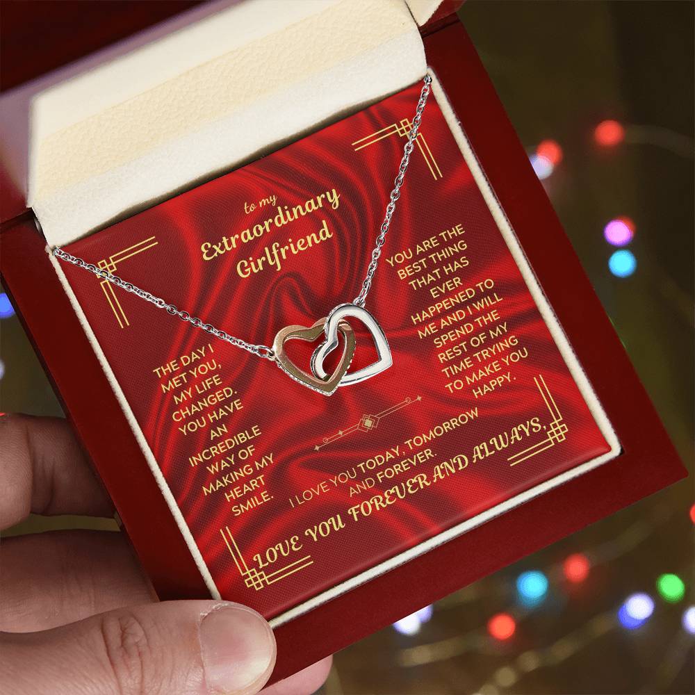 Interlocking hearts necklace pendant with chain inside red jewelry box