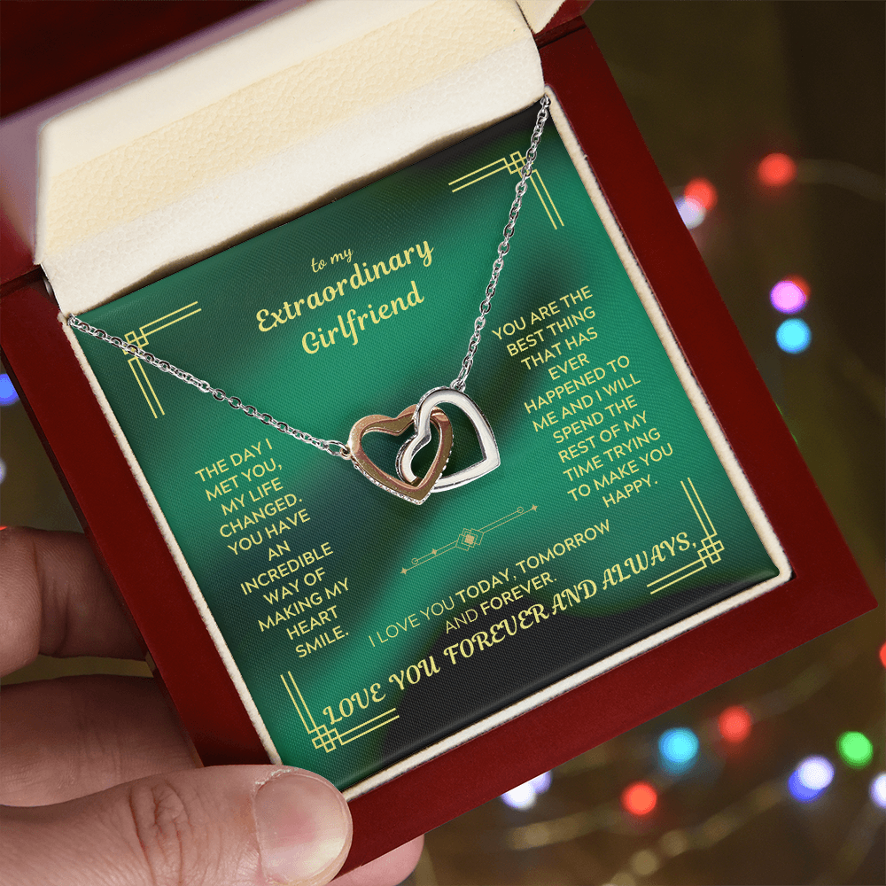 Interlocking heart necklace with gold-tone outer hearts and silver-tone inner heart pendant