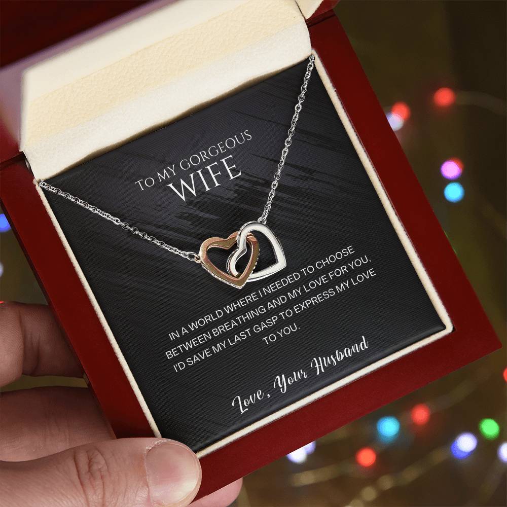 Rose gold and silver-tone double heart pendant necklace in a gift box.