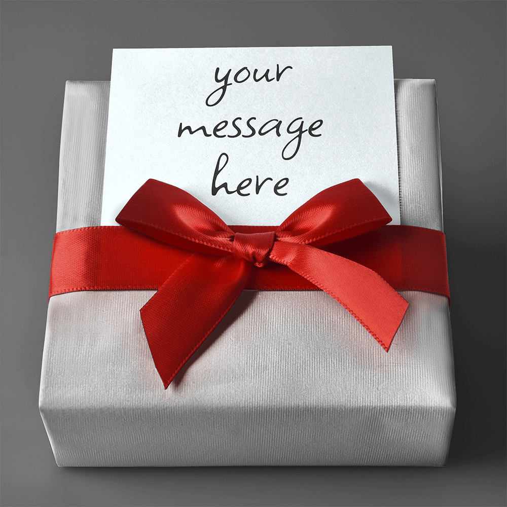 Personalized gift wrap with red ribbon bow and card reading 'your message here'.