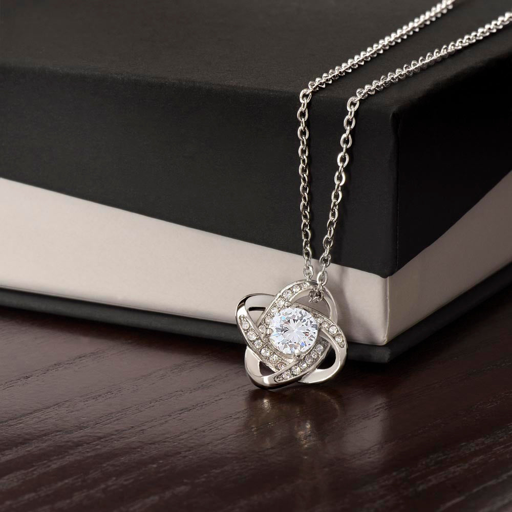 Love knot necklace with round crystal pendant and silver-tone chain