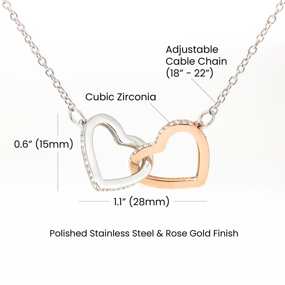 Interlocking hearts pendant necklace with silver heart, rose-gold detail, cubic zirconia