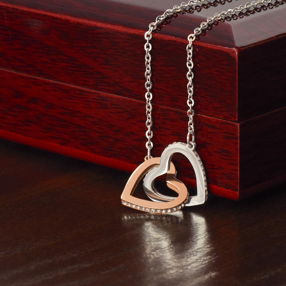 Interlocking hearts necklace with rose-gold, silver and cubic zirconia heart pendants