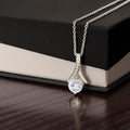 Silver-tone necklace with teardrop pendant and round sparkling stone, slim chain
