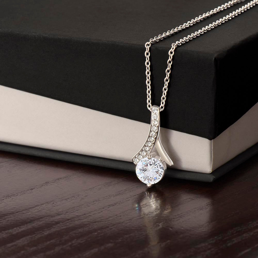 Silver-tone necklace with teardrop pendant and round sparkling stone, slim chain