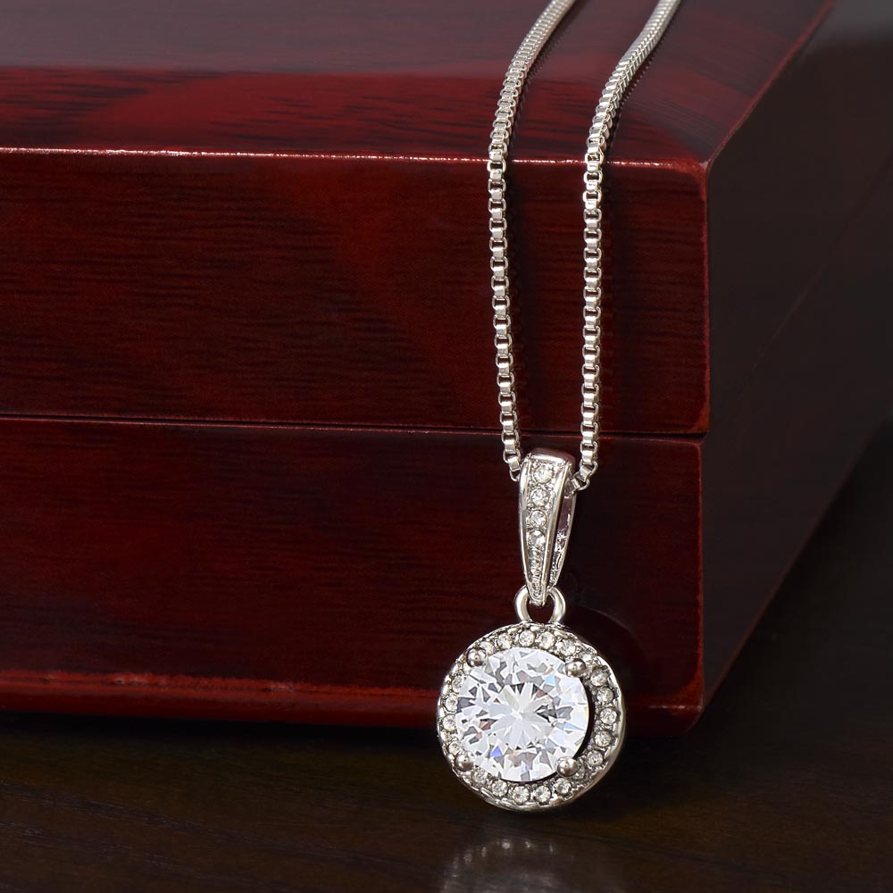 Silver-tone round halo pendant necklace with cubic zirconia center on link chain
