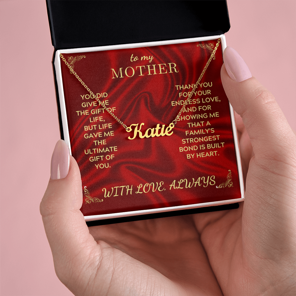 Personalized name necklace with Katie pendant and gold-tone chain in gift box, held
