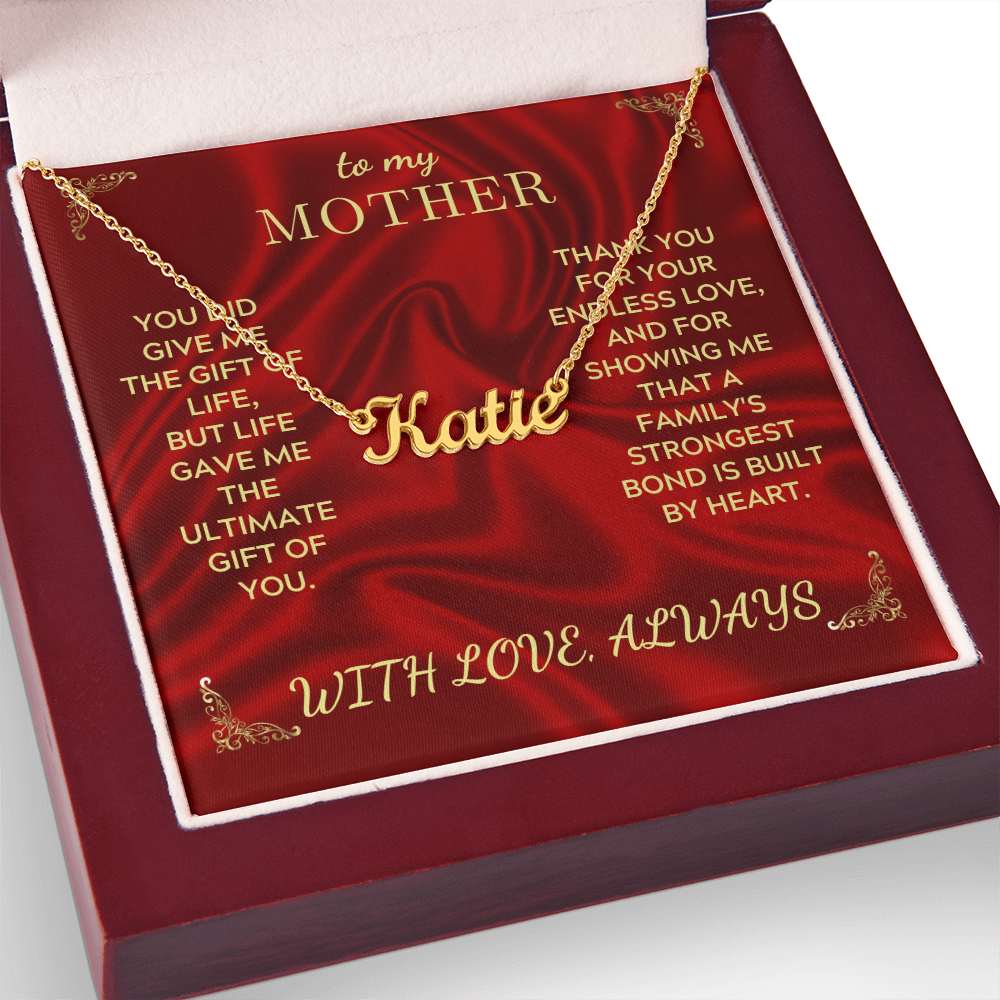 Personalized name necklace with gold chain on burgundy gift box, name Katie visible