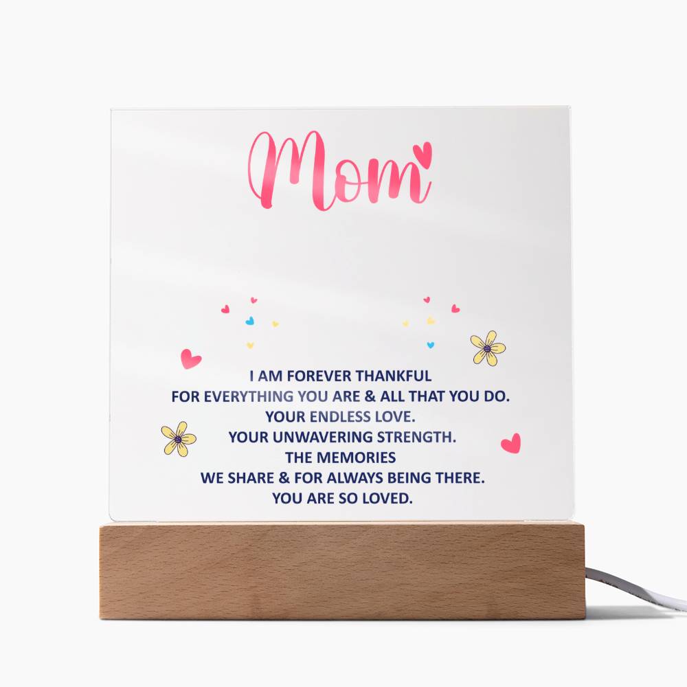 Acrylic “Mom” keepsake plaque with blue message text and wood base