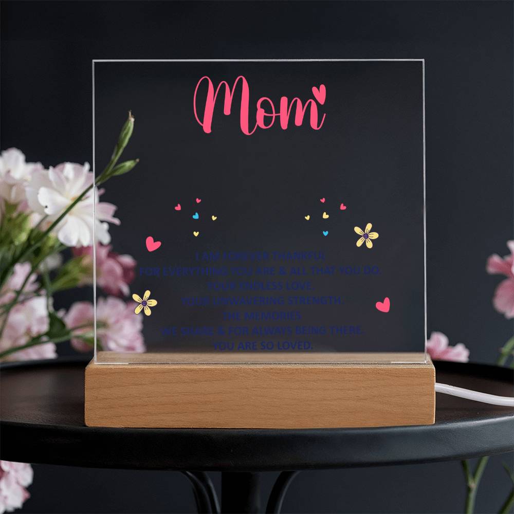 Acrylic “Mom” keepsake with colorful hearts and flowers on wood base