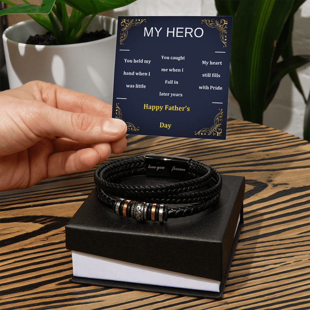 Black braided bracelet on gift box with gold and silver bead centerpiece