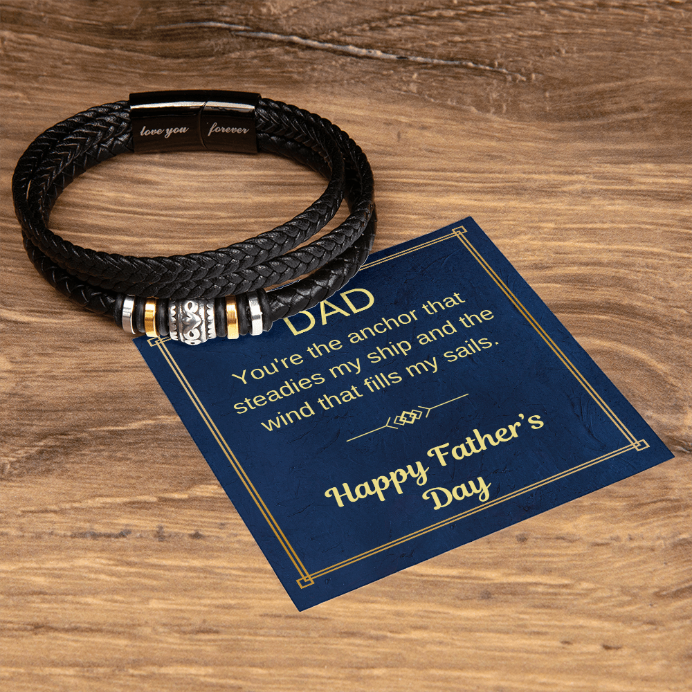 Black braided bracelet with gold and silver segments shown with a Father’s Day card.