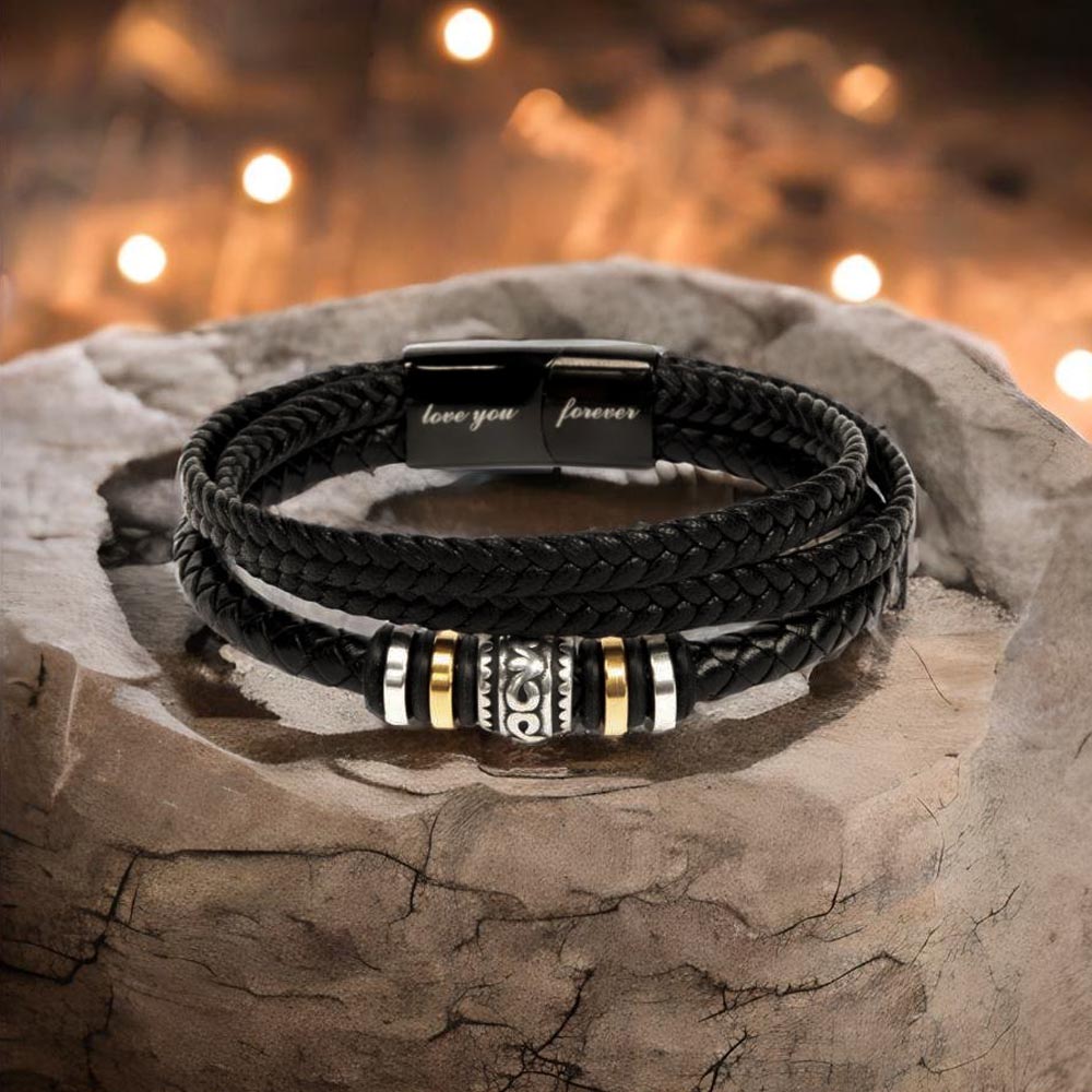 Black braided wrap bracelet with round center charm and engraved text segments