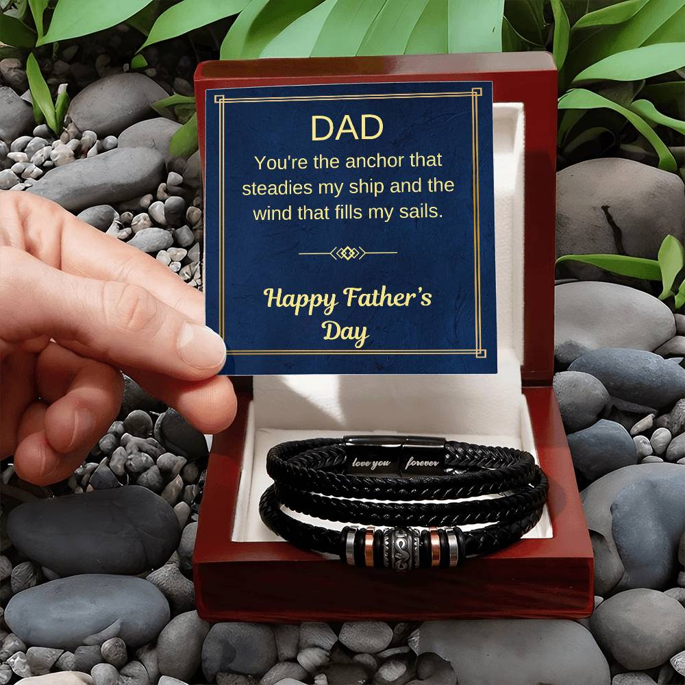 Braided black bracelet with metal bead accents in open red gift box