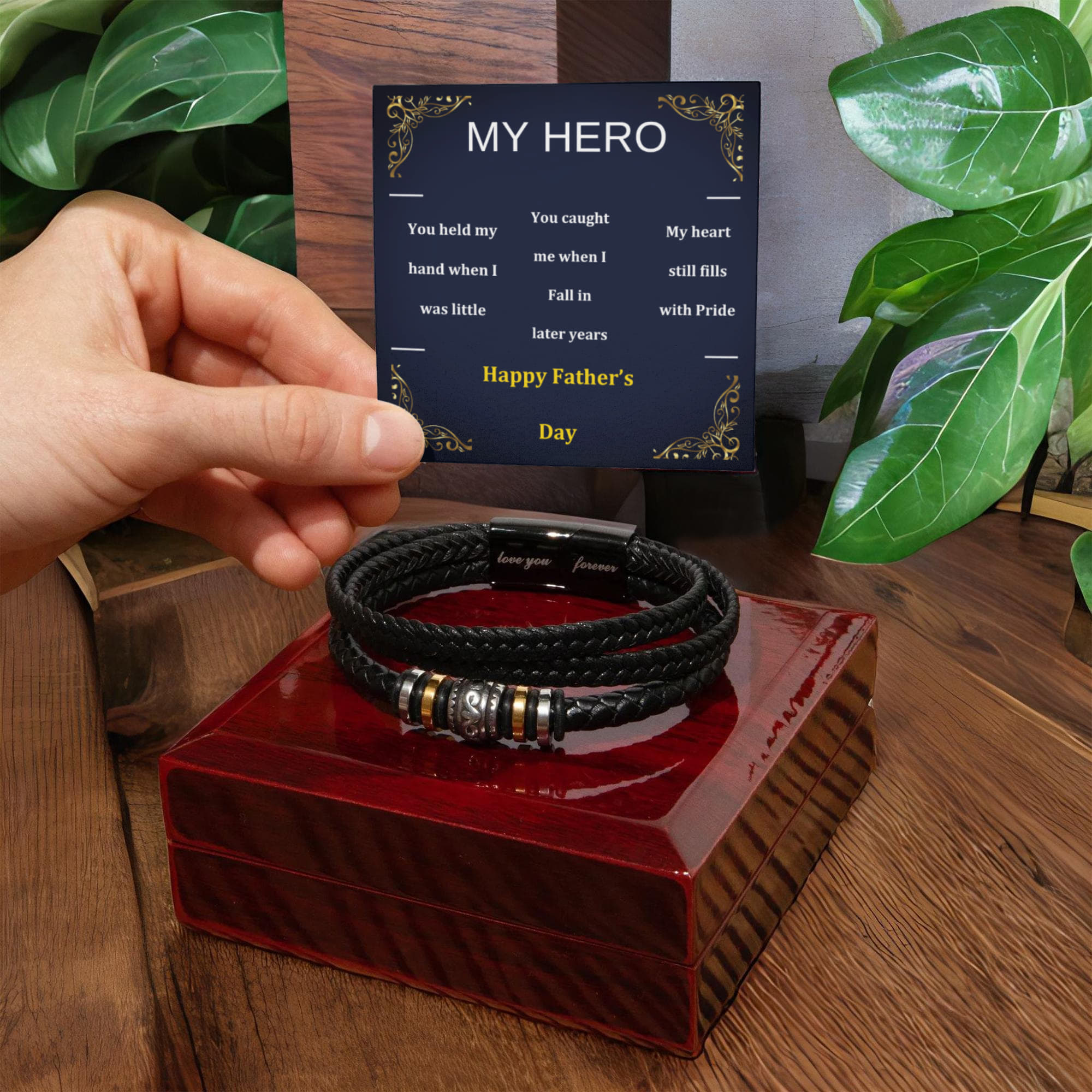 Black braided vegan leather bracelet on an open gift box