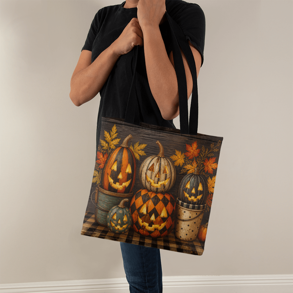 Halloween canvas tote bag with black handles, full front pumpkin display