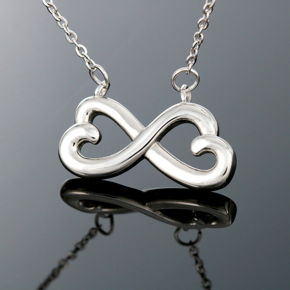 Infinity heart pendant necklace with silver-tone chain and double-loop design