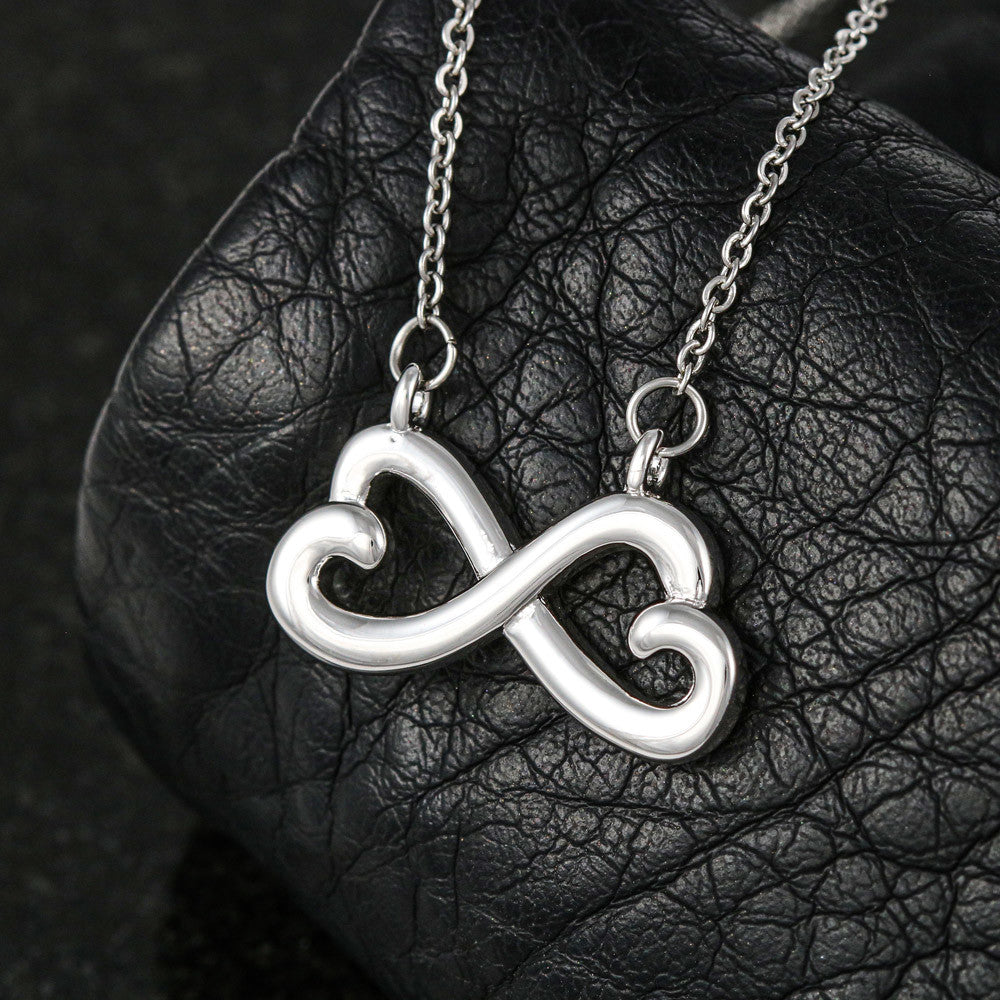 Infinity heart pendant necklace with link chain, silver-tone finish on black leather