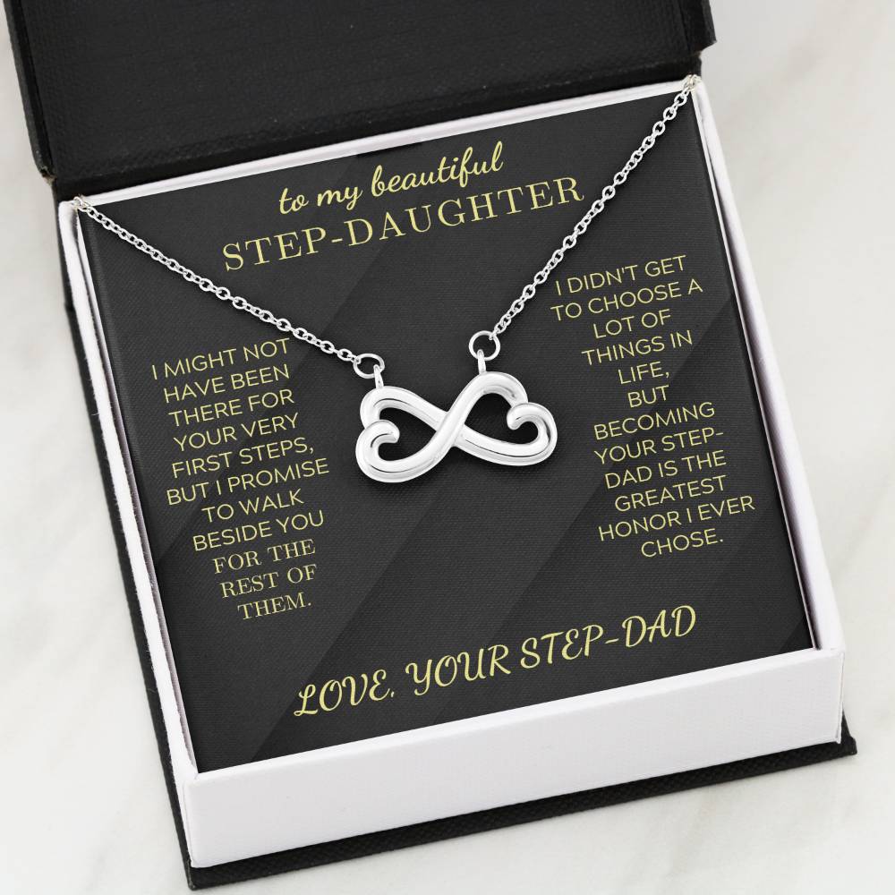 Silver heart-infinity pendant necklace on black insert inside white gift box