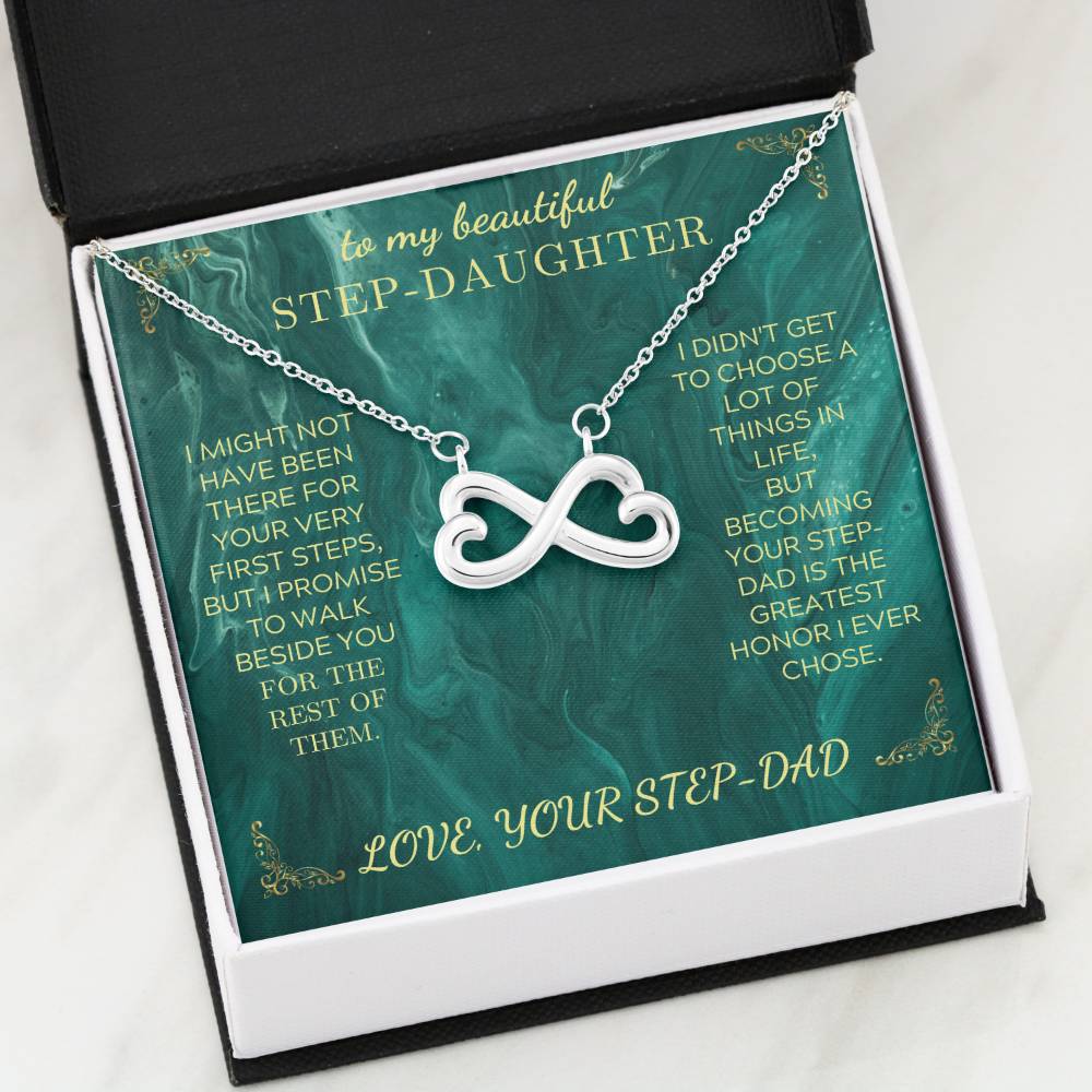 Silver heart infinity pendant necklace on green message card inside an open black box