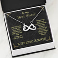 Infinity heart pendant necklace in open black gift box with “Best Sister” card