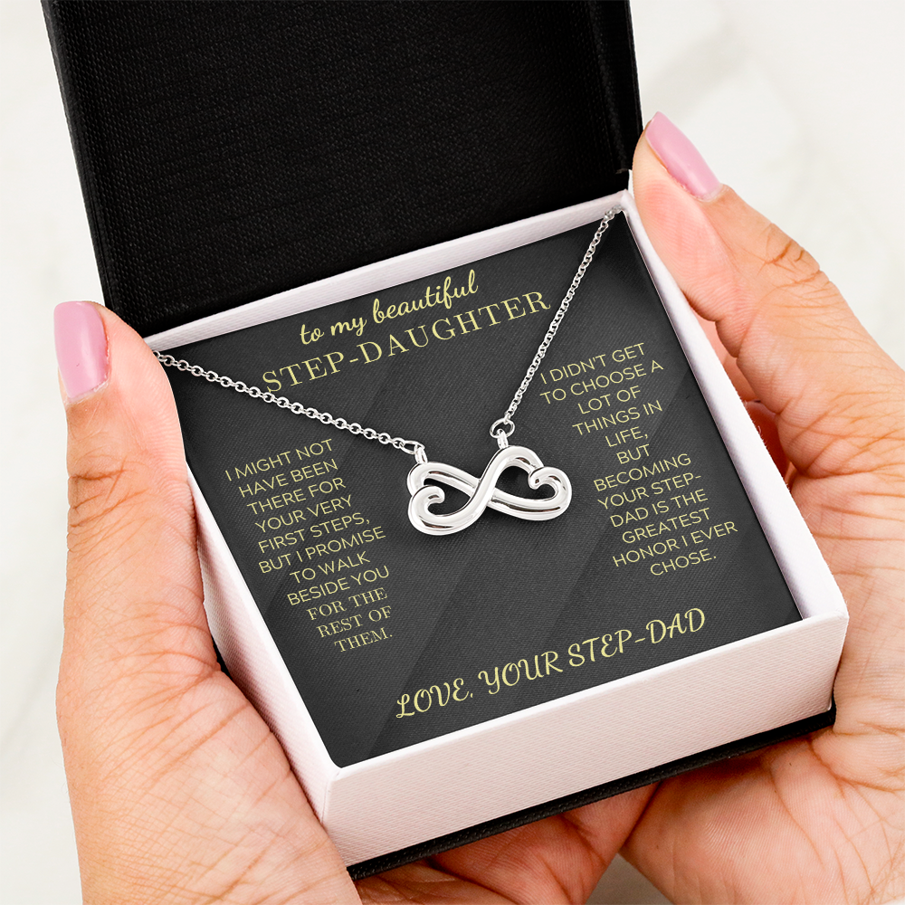 Silver heart-infinity pendant necklace on black insert in open gift box