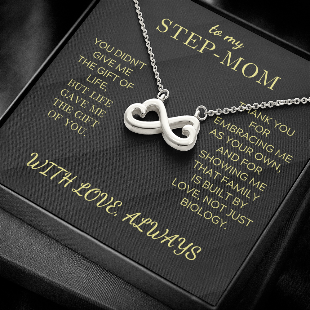 Infinity heart pendant necklace with silver chain, displayed on a gift box card