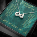 Silver heart infinity pendant necklace on green message card, close-up view