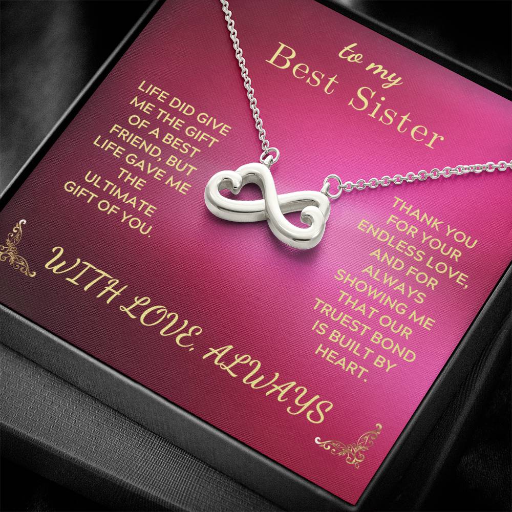 Silver-tone infinity heart pendant necklace on rose gift card with chain