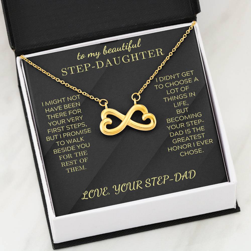 Gold infinity heart pendant necklace on black velvet card in gift box