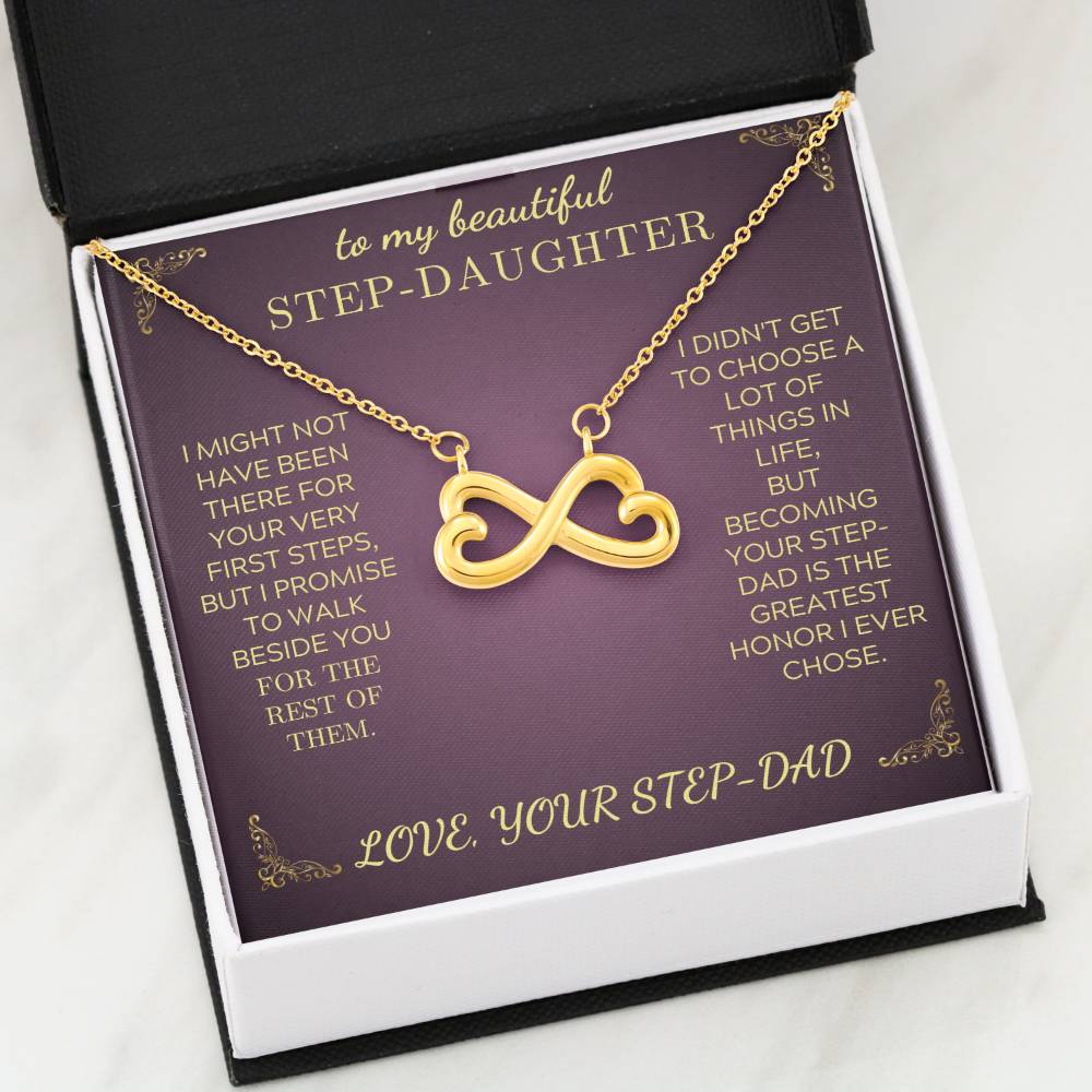 Gold infinity heart pendant necklace on purple card inside a gift box