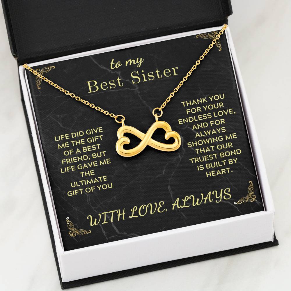 Gold infinity heart pendant necklace inside black gift box with message card