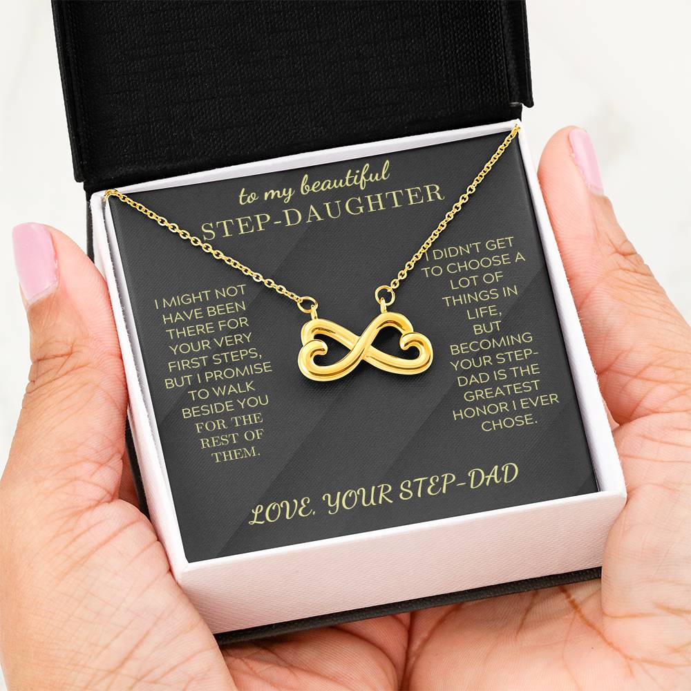 Gold infinity heart pendant necklace on black velvet card in white-lined box