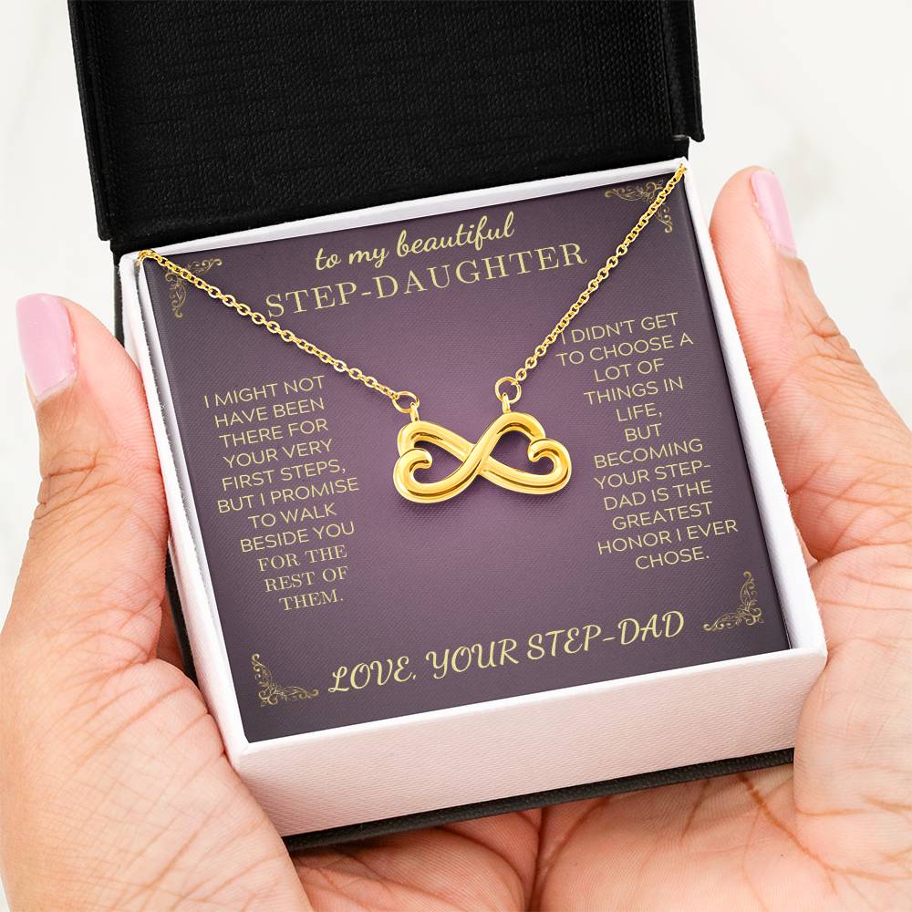 Gold infinity heart pendant necklace on purple card inside a gift box