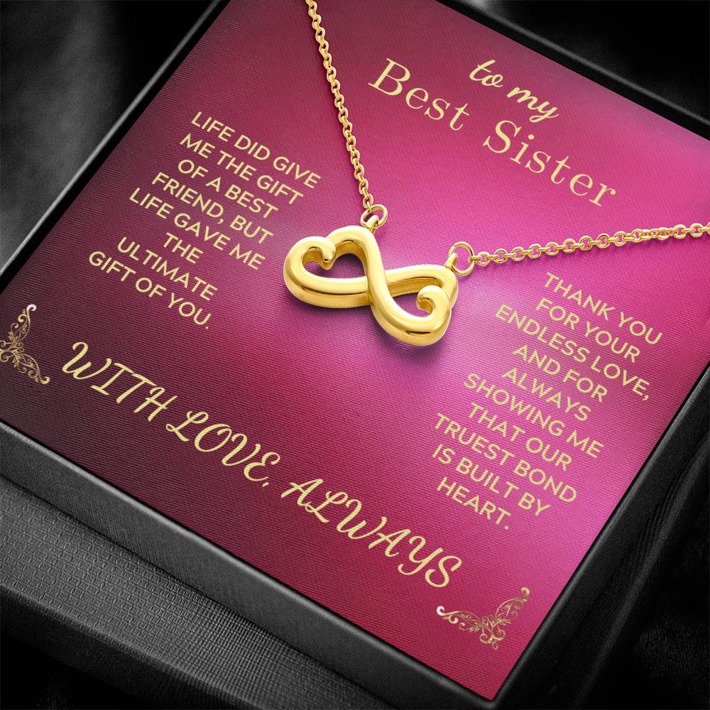 Gold-tone infinity heart pendant necklace on rose gift card with chain