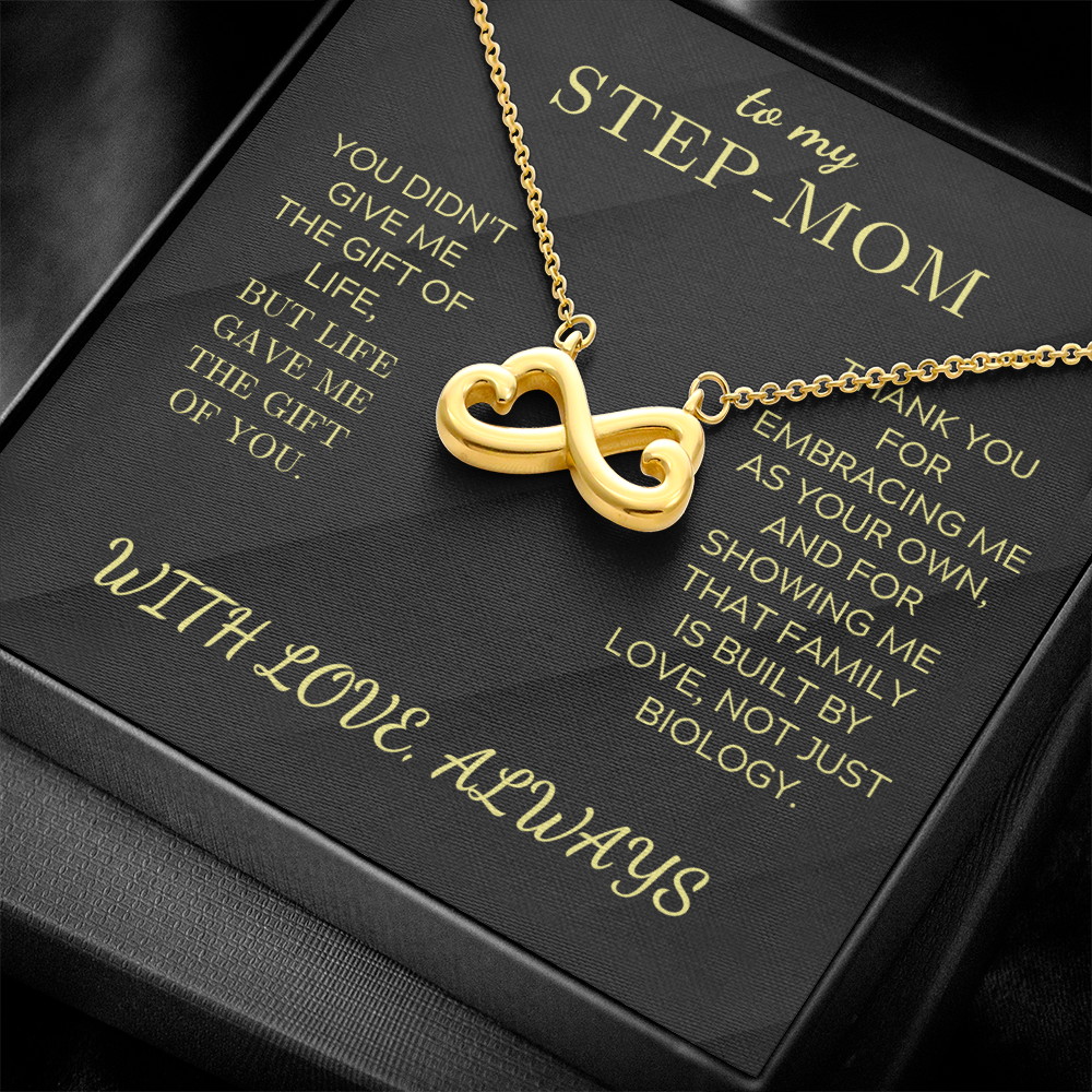 Infinity heart pendant necklace with gold chain, displayed on a gift box card