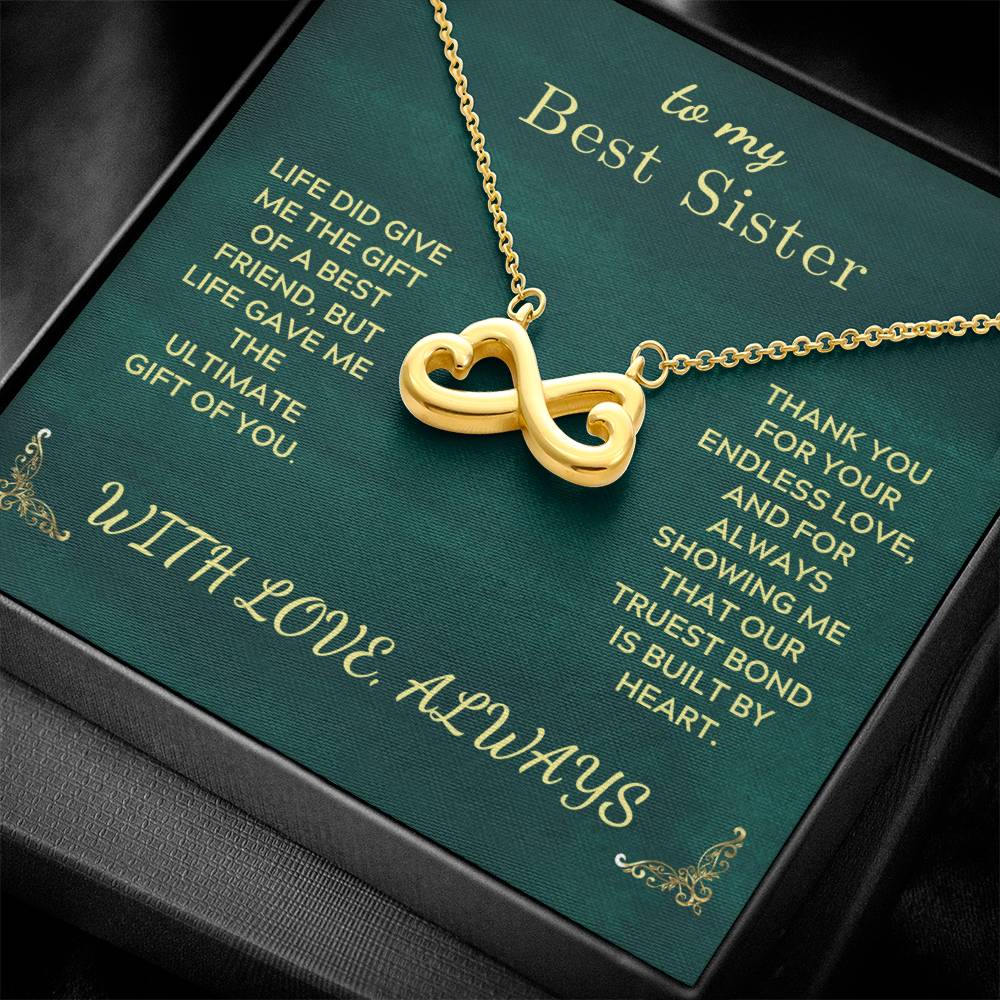Gold-tone infinity heart pendant necklace with adjustable cable chain detail