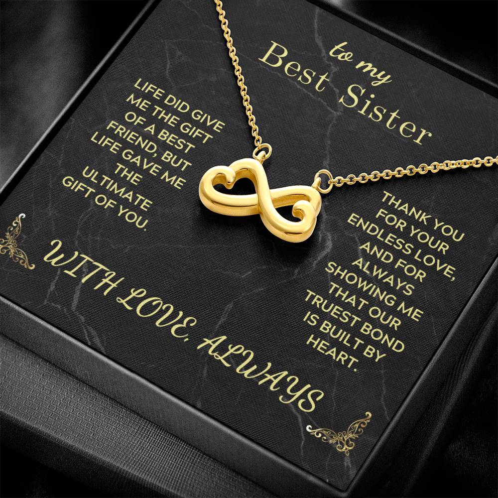 Infinity heart pendant necklace with gold-tone chain and adjustable clasp