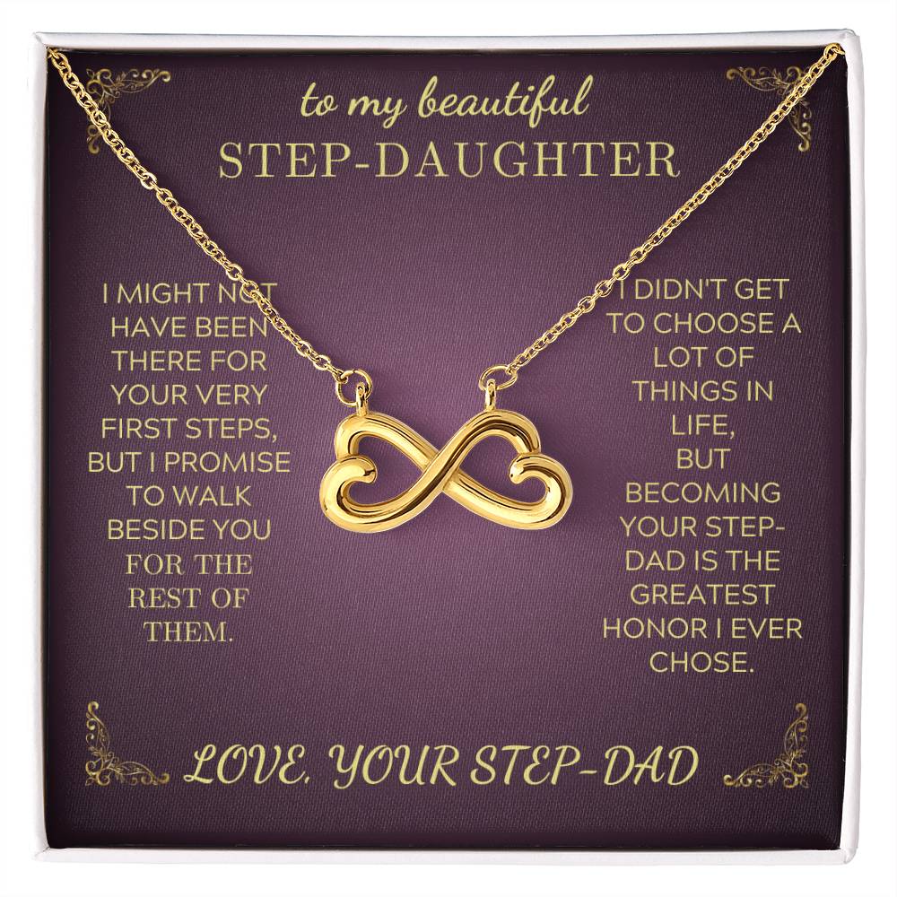 Gold-tone infinity heart pendant necklace on purple gift card, with long chain visible
