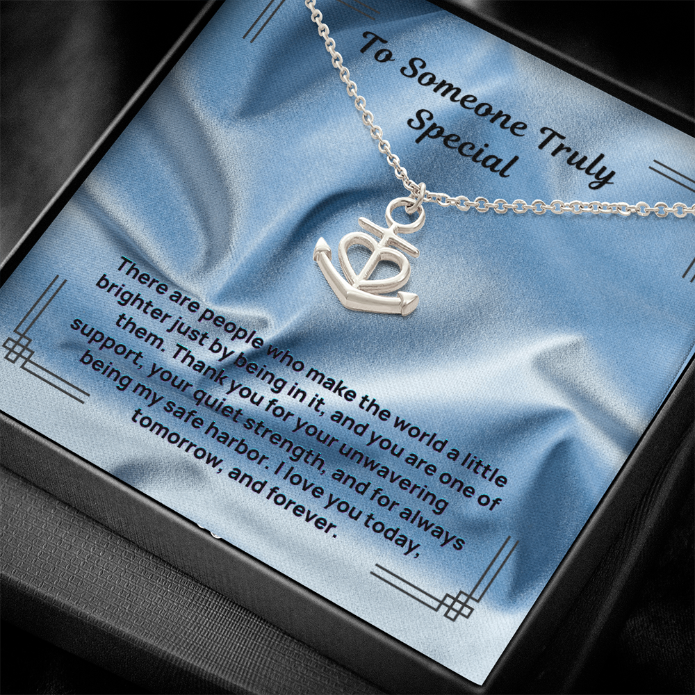 Anchor and heart pendant necklace on a silver chain, presented in a gift box.