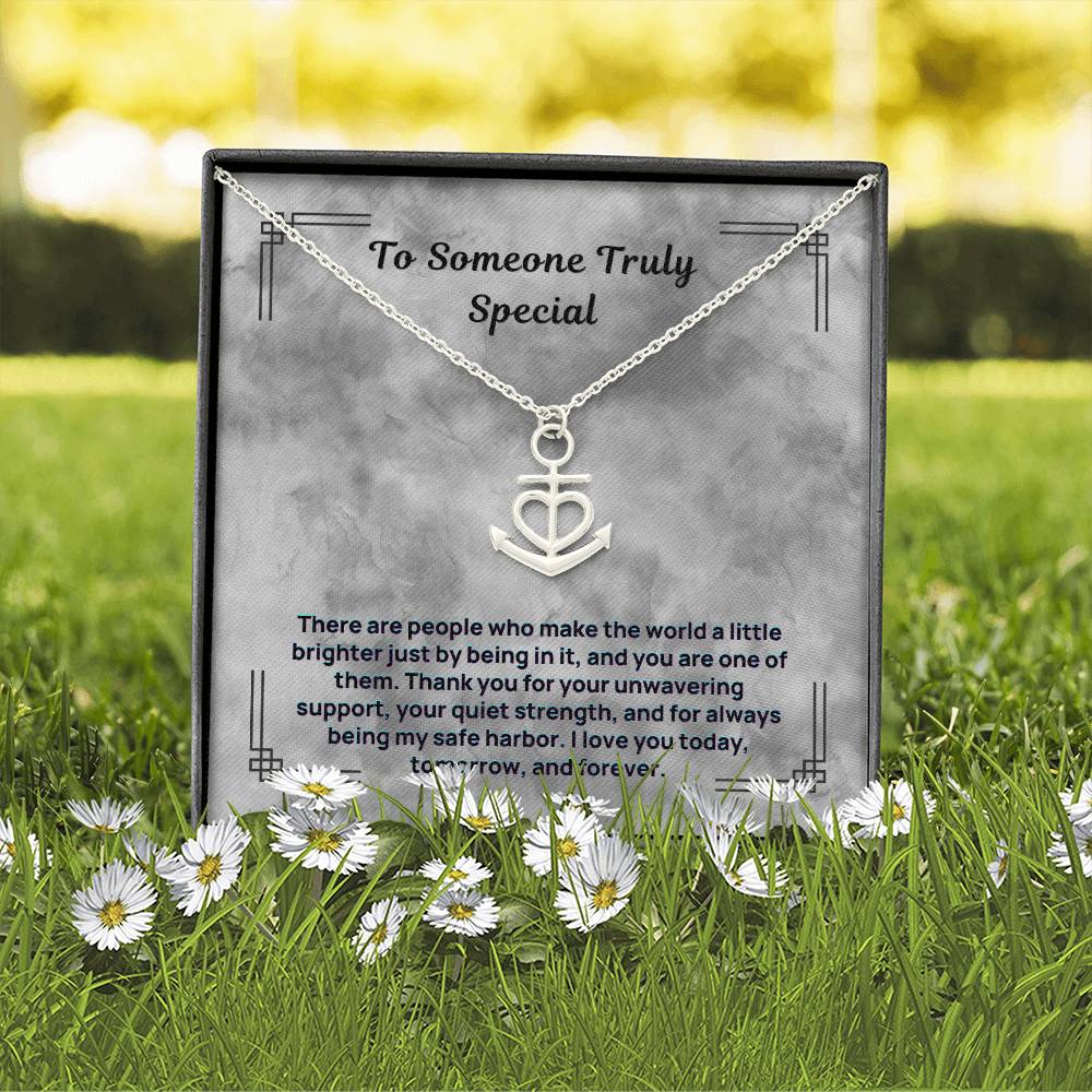 Silver anchor and heart pendant necklace on a gift card