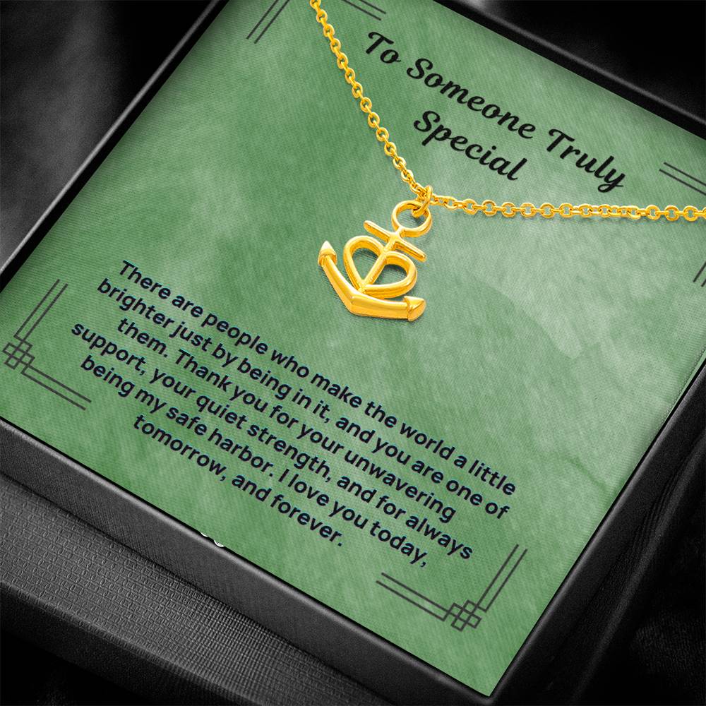 Gold anchor safe harbor pendant necklace close-up on chain and charm
