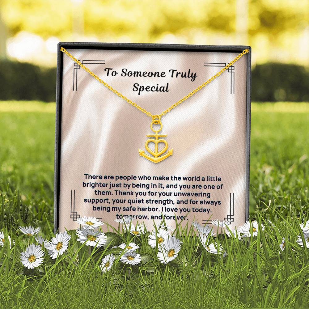 Gold anchor-and-heart pendant necklace in gift box with card insert