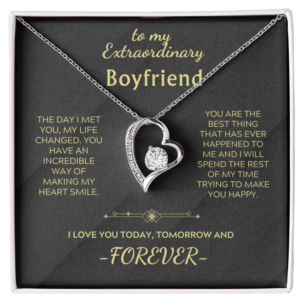 Heart pendant necklace with crystal center and silver chain in a gift box