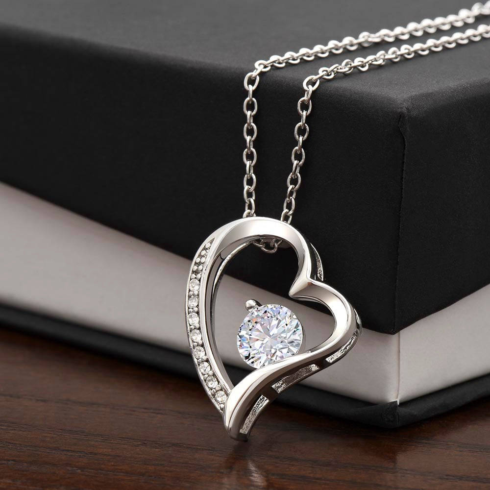 Silver-tone heart pendant necklace with round crystal and pavé edging