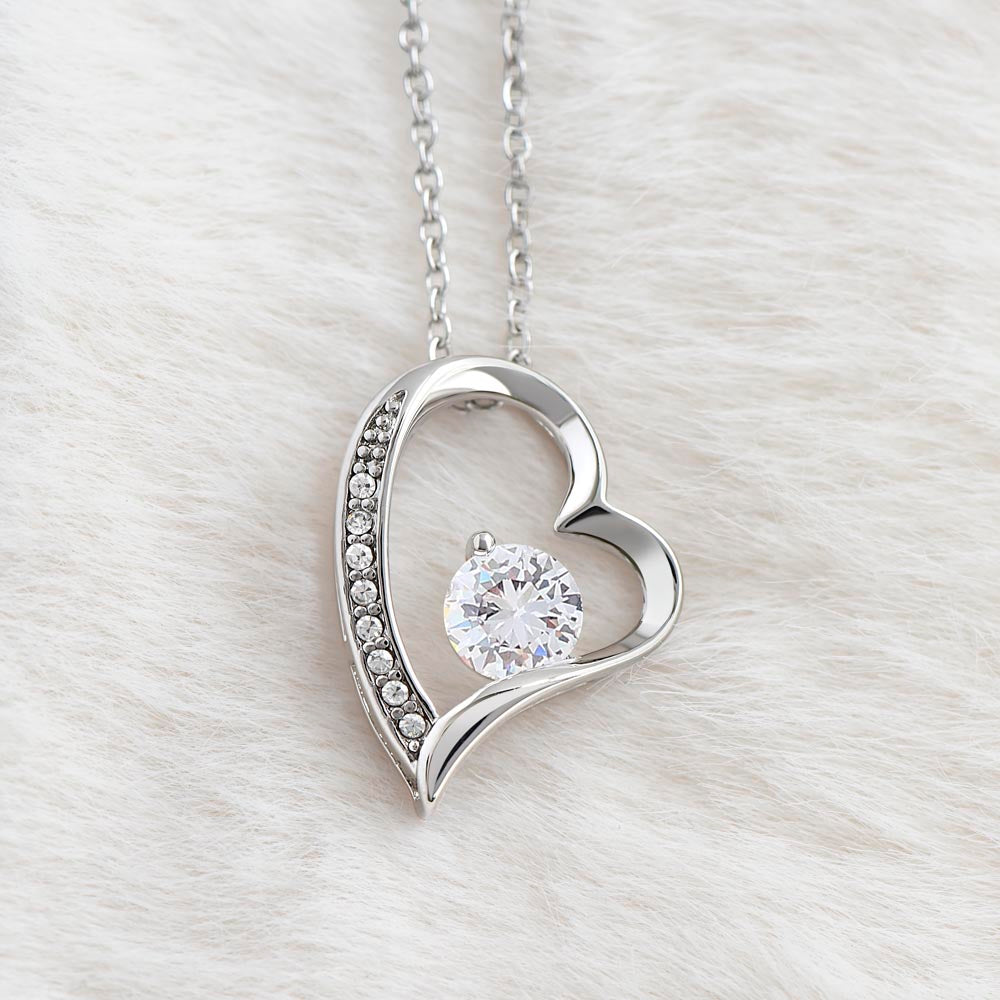 Silver heart pendant necklace with round clear crystal centerpiece