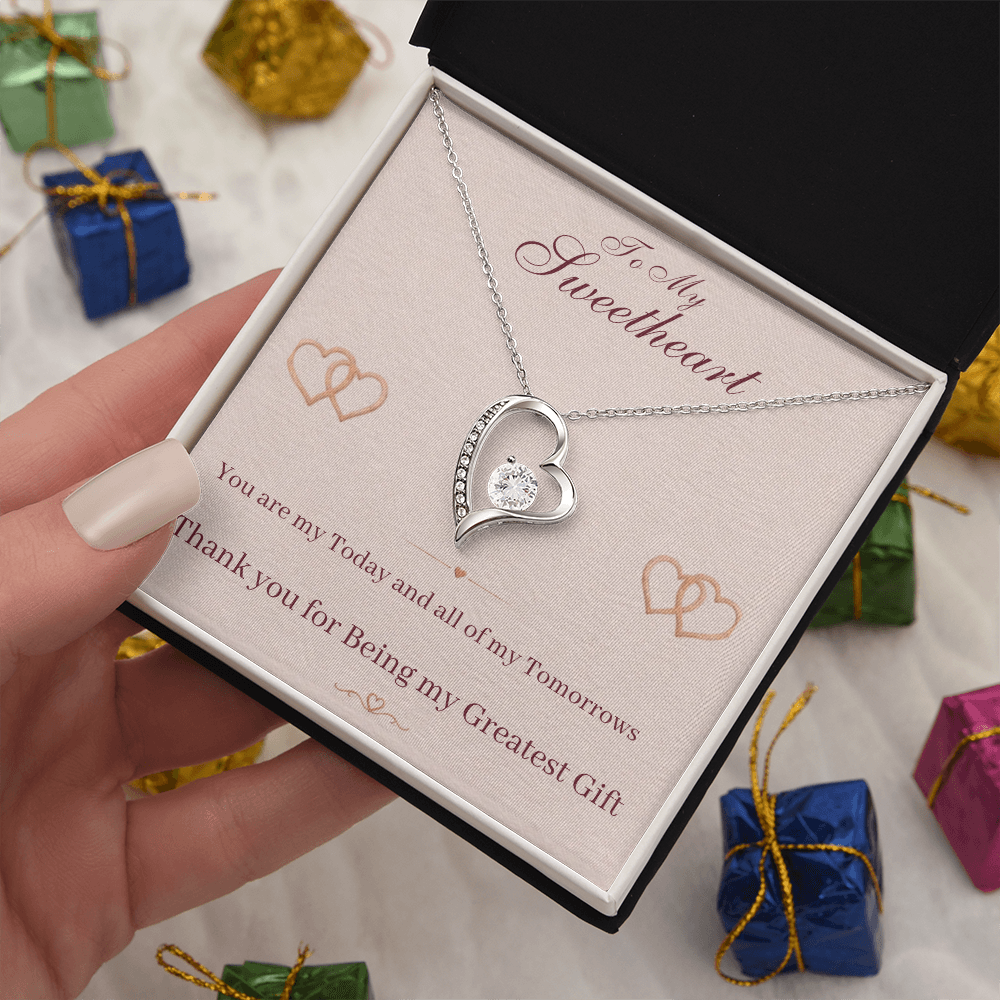 Silver heart pendant necklace in open gift box with sentimental message card and chain