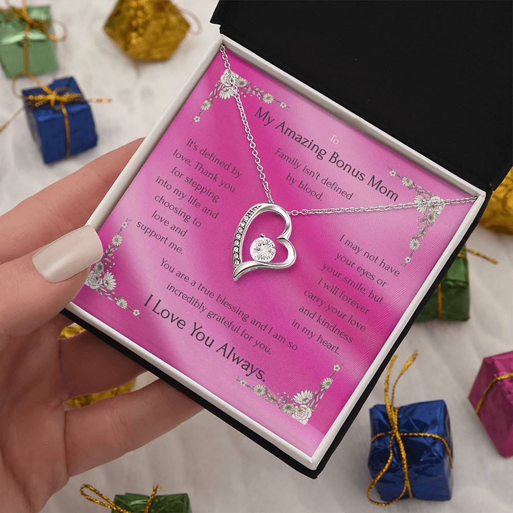 Heart pendant necklace with rhinestone edge, silver tone chain inside a pink gift box