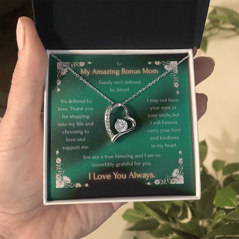 Silver heart pendant necklace with crystal accents, shown in a gift box